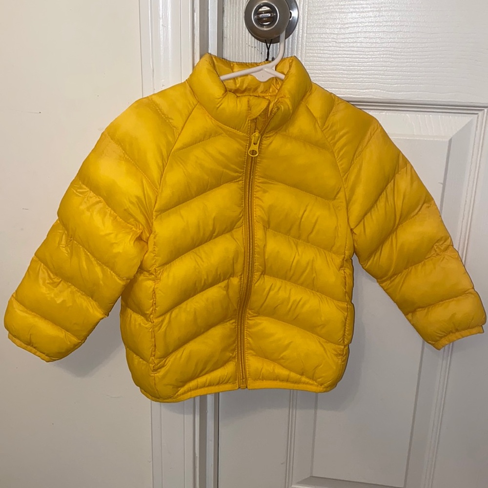 Toddlers yellow puffer coat.